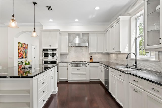 4310 W Sevilla St, Tampa, FL 33629 - kitchen with visible vents, wall chimney exhaust hood, stainless steel appliances, white cabinetry, and a sink