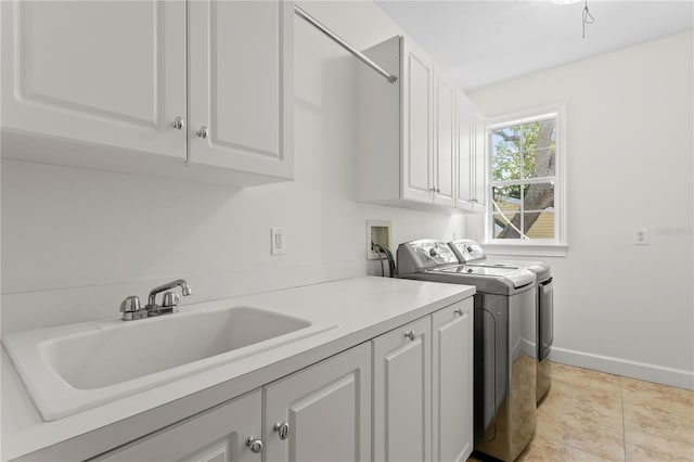 4310 W Sevilla St, Tampa, FL 33629 - laundry area featuring washer and clothes dryer, cabinet space, a sink, and baseboards