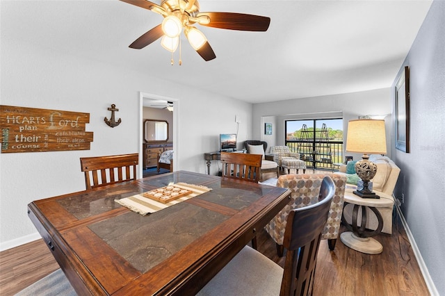 1901 Oyster Catcher Ln Unit 823, Clearwater, FL 33762 - dining room with wood finished floors, baseboards, and ceiling fan