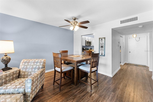 1901 Oyster Catcher Ln Unit 823, Clearwater, FL 33762 - dining space featuring baseboards, ceiling fan, visible vents, and wood finished floors
