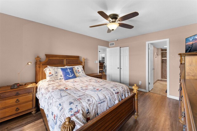 1901 Oyster Catcher Ln Unit 823, Clearwater, FL 33762 - bedroom with baseboards, ceiling fan, visible vents, a closet, and wood finished floors