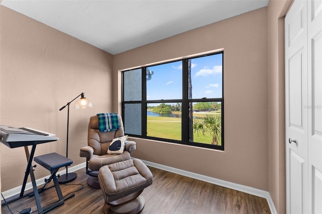 1901 Oyster Catcher Ln Unit 823, Clearwater, FL 33762 - living area featuring baseboards and wood finished floors