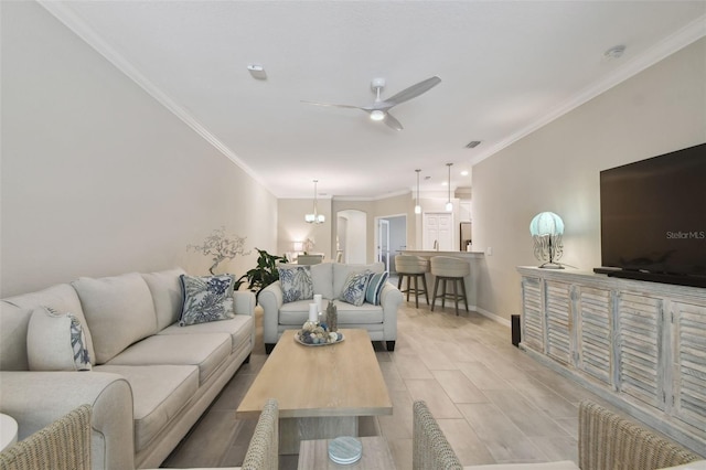 12379 Amica Loop, Venice, FL 34293 - living room with crown molding, ceiling fan, and baseboards