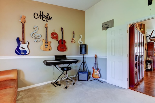 interior space with baseboards and carpet flooring