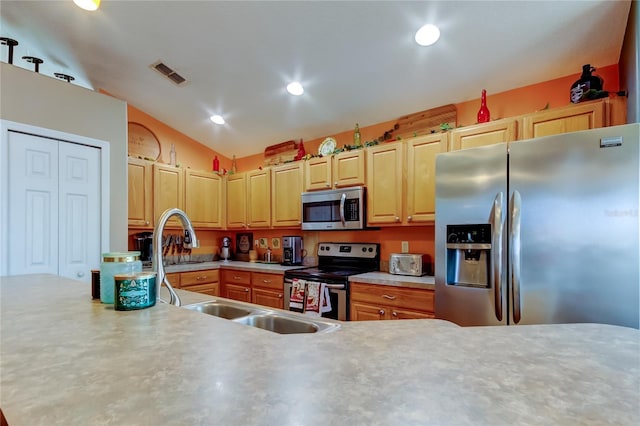 kitchen with light countertops, recessed lighting, a sink, visible vents, and appliances with stainless steel finishes