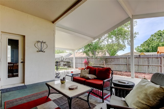 view of patio with an outdoor hangout area and fence