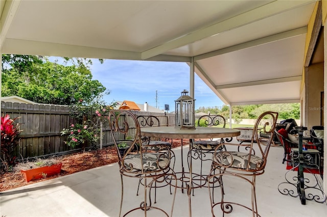 view of patio / terrace with outdoor dining area and a fenced backyard