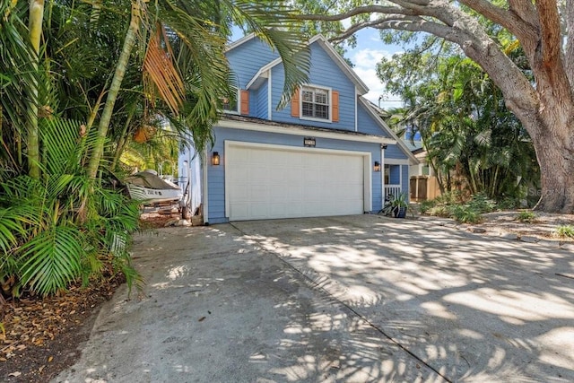 view of front of property featuring driveway and an attached garage