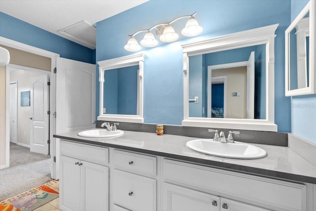 full bath with double vanity and a sink