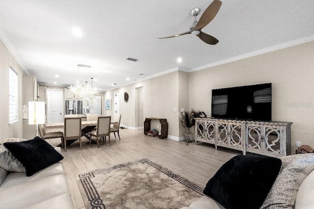 20647 Ovid Ln, Venice, FL 34293 - living room with ceiling fan with notable chandelier, light wood-type flooring, baseboards, and ornamental molding