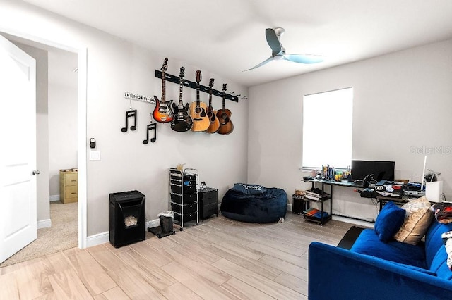 20647 Ovid Ln, Venice, FL 34293 - home office with baseboards, light wood-style floors, and a ceiling fan