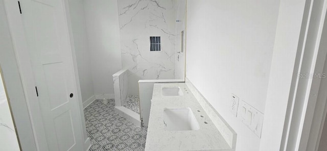 745 31st Ave N, Saint Petersburg, FL 33704 - bathroom featuring a marble finish shower and a sink