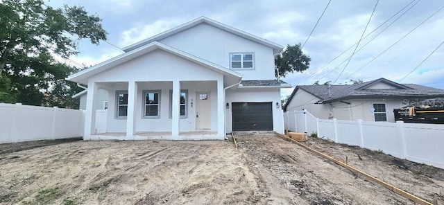 745 31st Ave N, Saint Petersburg, FL 33704 - view of front of home featuring covered porch, an attached garage, and dirt driveway