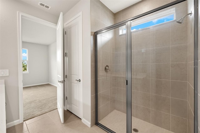 17800 Solstice Ave, Venice, FL 34293 - bathroom featuring a stall shower, baseboards, tile patterned flooring, and visible vents