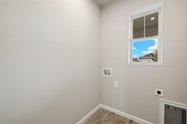 17800 Solstice Ave, Venice, FL 34293 - laundry area with laundry area, hookup for a washing machine, electric dryer hookup, light wood-type flooring, and baseboards