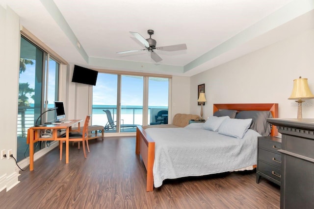 1350 Gulf Blvd Unit 301, Clearwater Beach, FL 33767 - bedroom with dark wood-style flooring, access to outside, and a tray ceiling