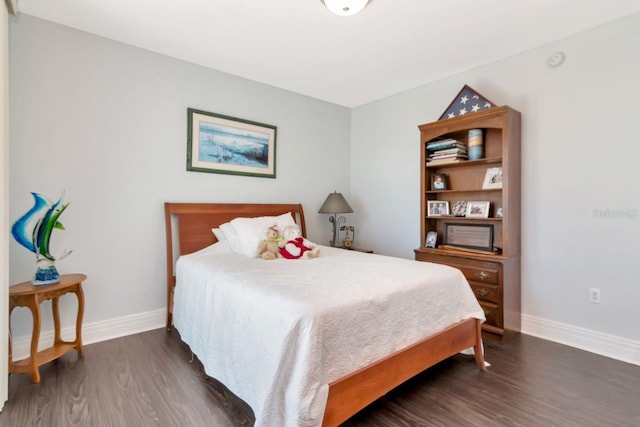 1350 Gulf Blvd Unit 301, Clearwater Beach, FL 33767 - bedroom featuring baseboards and wood finished floors