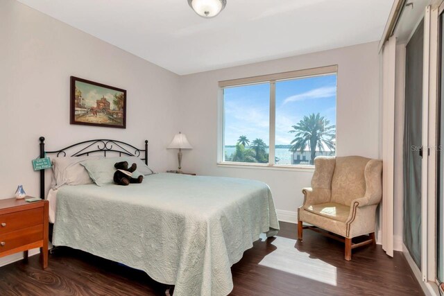 1350 Gulf Blvd Unit 301, Clearwater Beach, FL 33767 - bedroom featuring baseboards and wood finished floors