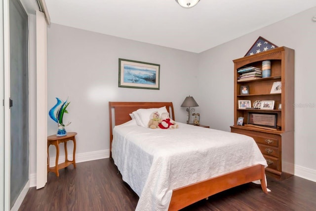 1350 Gulf Blvd Unit 301, Clearwater Beach, FL 33767 - bedroom with baseboards and wood finished floors
