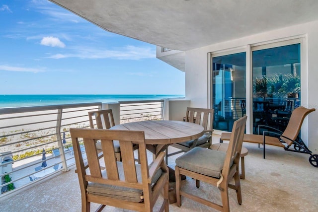 1350 Gulf Blvd Unit 301, Clearwater Beach, FL 33767 - balcony featuring outdoor dining area, a view of the beach, and a water view