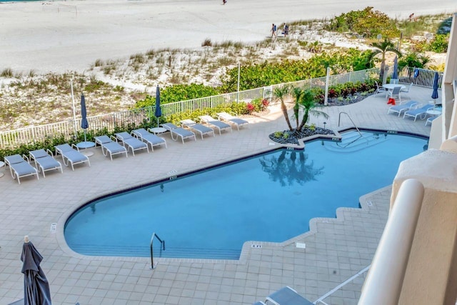 1350 Gulf Blvd Unit 301, Clearwater Beach, FL 33767 - pool featuring a patio and fence private yard