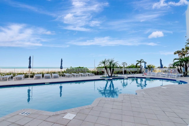 1350 Gulf Blvd Unit 301, Clearwater Beach, FL 33767 - community pool with fence and a patio