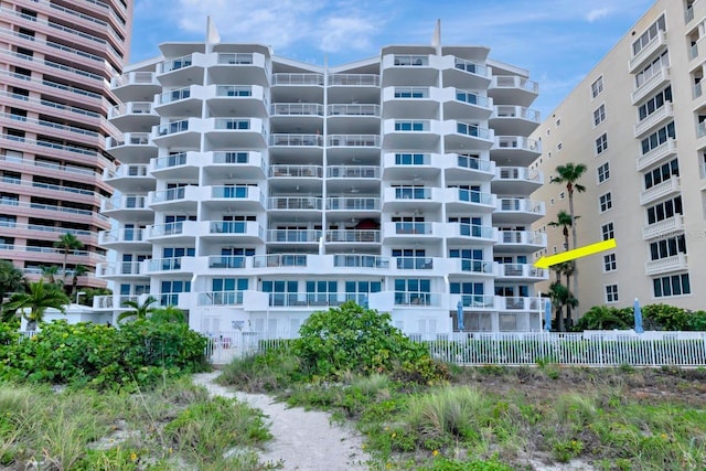 1350 Gulf Blvd Unit 301, Clearwater Beach, FL 33767 - view of building exterior with fence