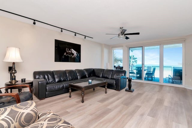 1350 Gulf Blvd Unit 301, Clearwater Beach, FL 33767 - living area featuring track lighting, wood finished floors, and ceiling fan