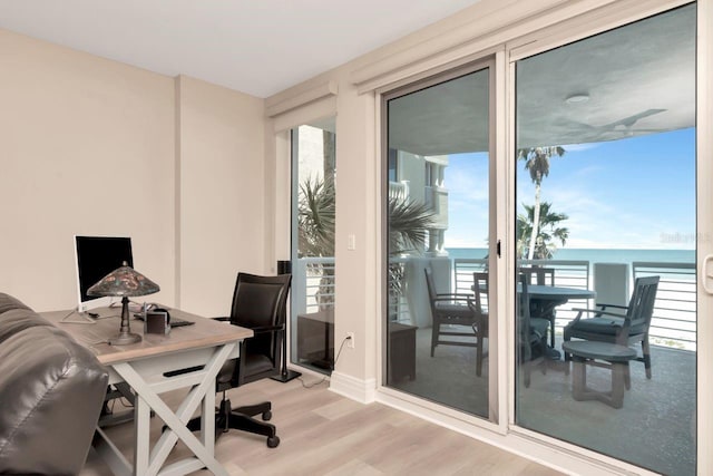 1350 Gulf Blvd Unit 301, Clearwater Beach, FL 33767 - office area featuring light wood-type flooring, a wealth of natural light, and a water view