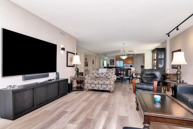 1350 Gulf Blvd Unit 301, Clearwater Beach, FL 33767 - living area featuring track lighting, light wood-style floors, and visible vents