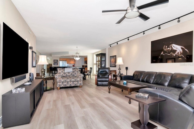 1350 Gulf Blvd Unit 301, Clearwater Beach, FL 33767 - living room featuring rail lighting, light wood-style floors, and ceiling fan