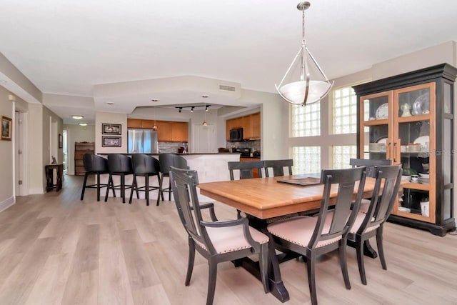 1350 Gulf Blvd Unit 301, Clearwater Beach, FL 33767 - dining area with visible vents and light wood finished floors