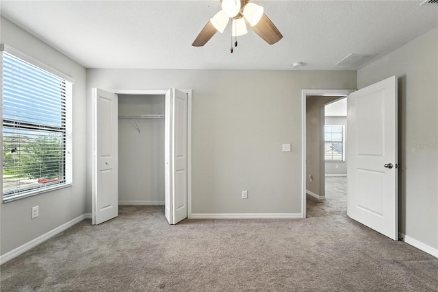 14050 Arbor Pines Dr, Riverview, FL 33579 - unfurnished bedroom featuring carpet floors, a ceiling fan, and a closet