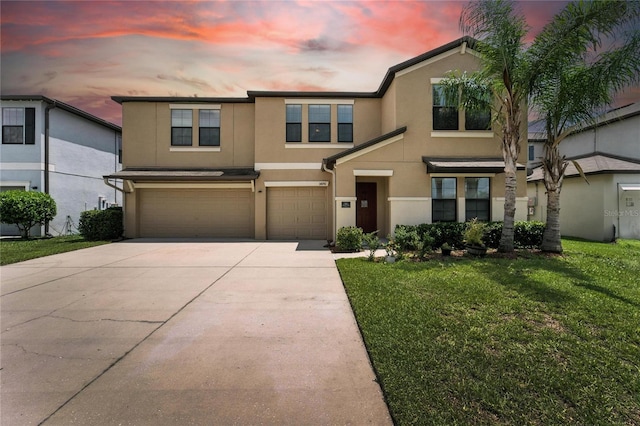 14050 Arbor Pines Dr, Riverview, FL 33579 - view of front of property featuring an attached garage, concrete driveway, stucco siding, and a lawn