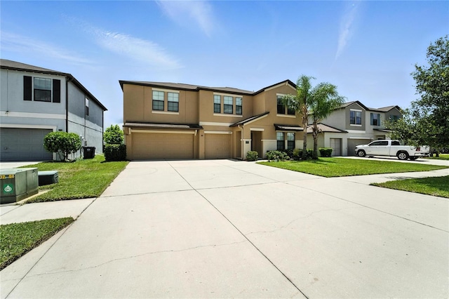 14050 Arbor Pines Dr, Riverview, FL 33579 - view of front of house with an attached garage, stucco siding, concrete driveway, and a front yard