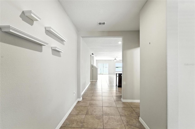 14050 Arbor Pines Dr, Riverview, FL 33579 - hall with light tile patterned floors and baseboards