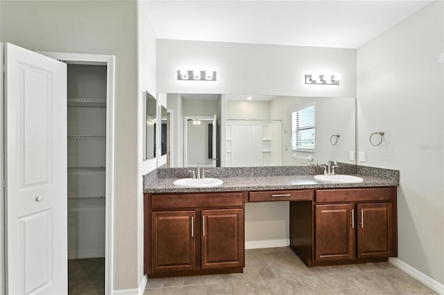 14050 Arbor Pines Dr, Riverview, FL 33579 - bathroom featuring double vanity, a shower with shower door, and a spacious closet