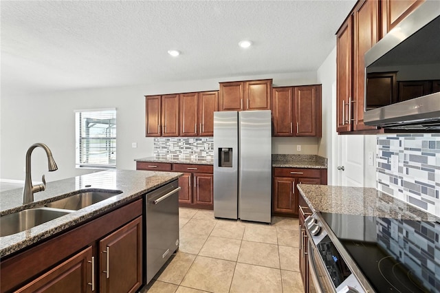 14050 Arbor Pines Dr, Riverview, FL 33579 - kitchen with appliances with stainless steel finishes, backsplash, dark stone counters, a textured ceiling, and recessed lighting