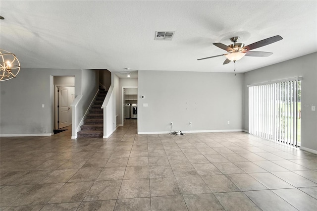 14050 Arbor Pines Dr, Riverview, FL 33579 - unfurnished living room featuring stairs, a ceiling fan, light tile patterned floors, a chandelier, and a textured ceiling
