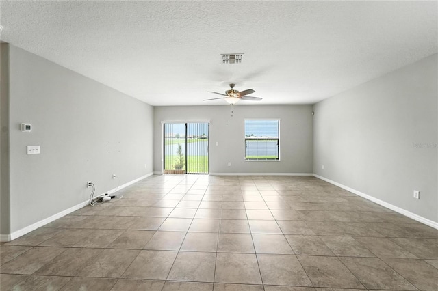 14050 Arbor Pines Dr, Riverview, FL 33579 - unfurnished room with a ceiling fan, tile patterned flooring, and a textured ceiling