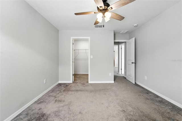 14050 Arbor Pines Dr, Riverview, FL 33579 - unfurnished bedroom with carpet flooring, a spacious closet, ceiling fan, and a closet