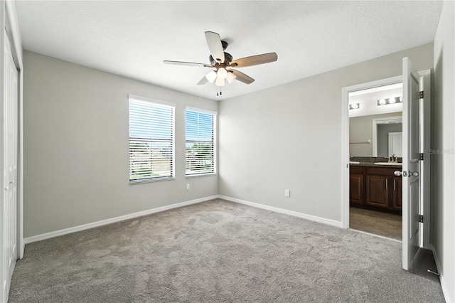 14050 Arbor Pines Dr, Riverview, FL 33579 - unfurnished bedroom with light carpet, ensuite bathroom, and a ceiling fan