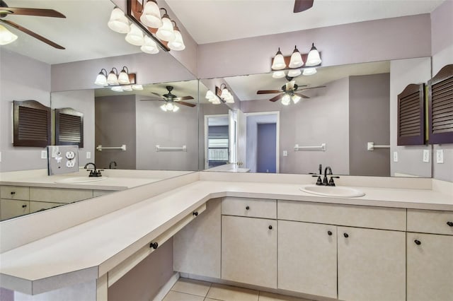 bathroom with tile patterned floors, vanity, and a ceiling fan