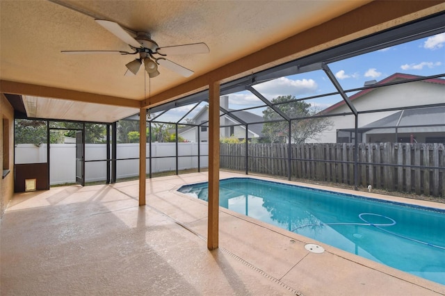 view of swimming pool featuring a patio area, a fenced in pool, ceiling fan, and a fenced backyard