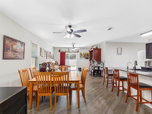 5946 81st Ave N, Pinellas Park, FL 33781 - dining room with ceiling fan, visible vents, and wood finished floors