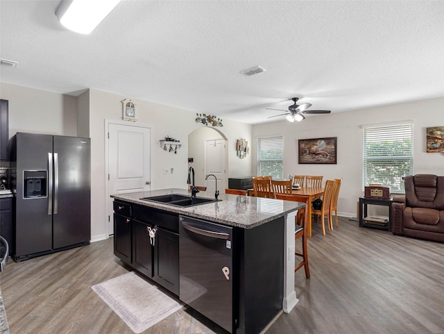5946 81st Ave N, Pinellas Park, FL 33781 - kitchen with stainless steel fridge, dishwasher, a ceiling fan, a sink, and a kitchen breakfast bar