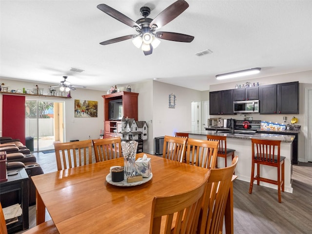 5946 81st Ave N, Pinellas Park, FL 33781 - dining area with visible vents, light wood-style floors, and a ceiling fan