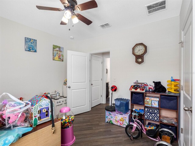 5946 81st Ave N, Pinellas Park, FL 33781 - rec room with visible vents, a ceiling fan, and wood finished floors