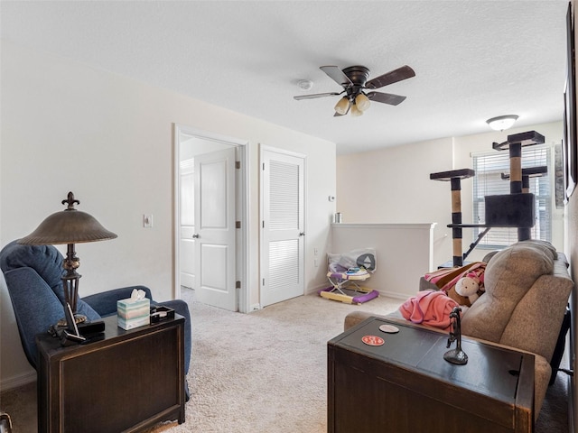 5946 81st Ave N, Pinellas Park, FL 33781 - living room with a ceiling fan, carpet, baseboards, and a textured ceiling