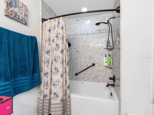 5946 81st Ave N, Pinellas Park, FL 33781 - bathroom featuring shower / tub combo and a textured ceiling